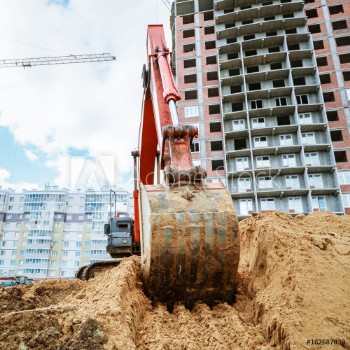 Bild på Excavator rakes bucket sand Construction work on site